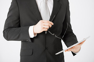 Image showing man with tablet pc and eyeglasses