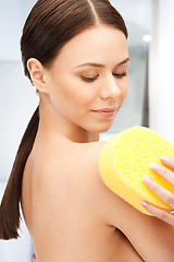 Image showing beautiful woman with sponge