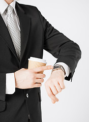 Image showing man looking at wristwatch