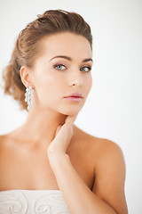 Image showing woman wearing shiny diamond earrings