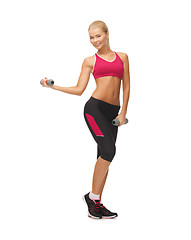 Image showing young sporty woman with light dumbbells