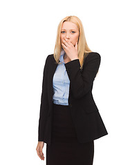 Image showing businesswoman closing her mouth with hand