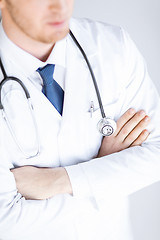 Image showing doctor with stethoscope in white uniform