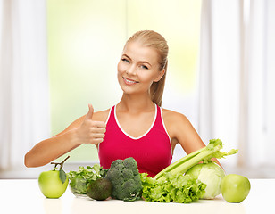 Image showing woman shows thumbs up with organic food