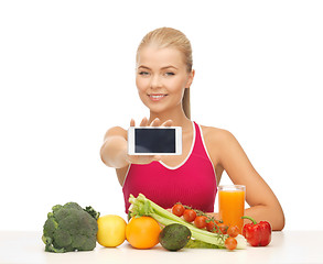 Image showing woman with fruits, vegetables and smartphone