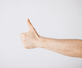 Image showing man showing thumbs up