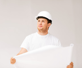 Image showing male architect looking at blueprint