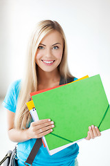 Image showing smiling student with folders