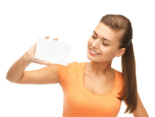 Image showing smiling woman holding white blank card