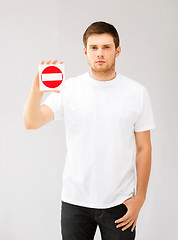 Image showing young man showing no entry sign