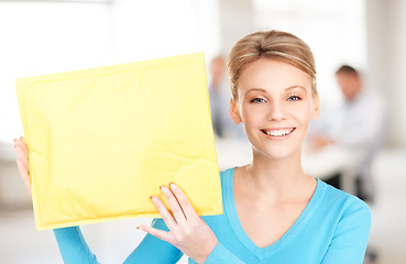 Image showing businesswoman with parcel