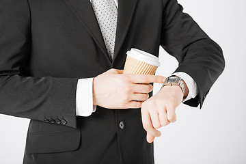 Image showing man looking at wristwatch