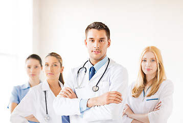 Image showing male doctor in front of medical group