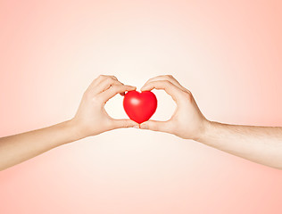 Image showing woman and man hands with heart