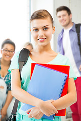 Image showing student girl with school bag and notebooks