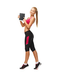 Image showing sporty woman with tablet pc