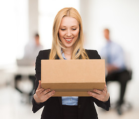 Image showing businesswoman with cardboard box