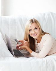 Image showing businesswoman with laptop and credit card