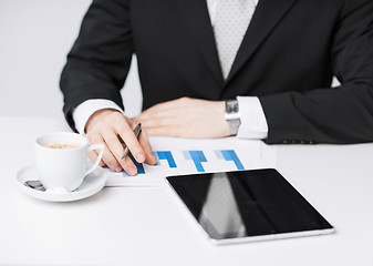 Image showing man with tablet pc and cup of coffee