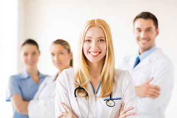 Image showing female doctor in front of medical group