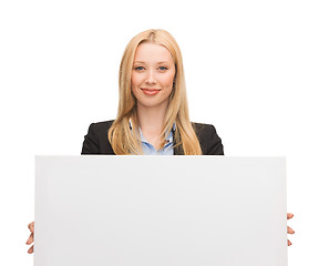 Image showing businesswoman with white blank board