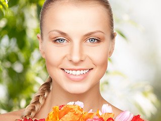 Image showing lovely woman with red flowers