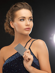 Image showing woman in evening dress with plastic card