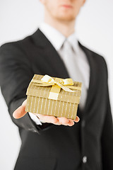 Image showing man hands holding gift box