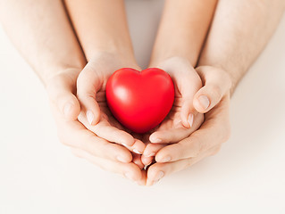 Image showing woman and man hands with heart