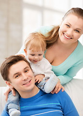 Image showing happy parents playing with adorable baby