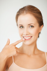 Image showing woman showing her teeth