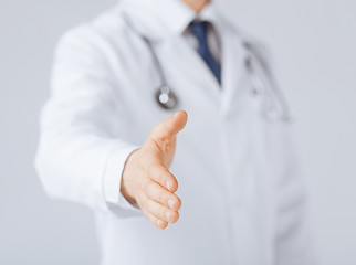 Image showing male doctor with open hand ready for hugging