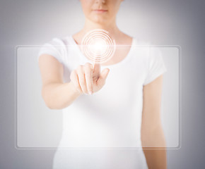 Image showing woman hand touching virtual screen