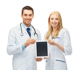 Image showing young doctors showing tablet pc