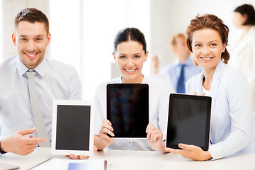 Image showing business team showing tablet pcs in office