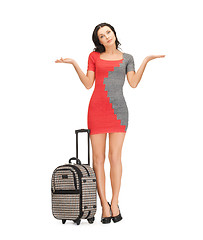 Image showing doubting woman with suitcase