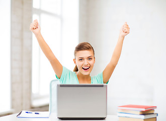 Image showing happy student girl with laptop at school