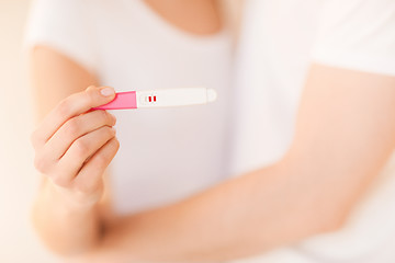 Image showing woman and man hands with pregnancy test