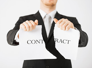 Image showing man hands tearing contract paper