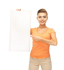 Image showing woman pointing at white blank board