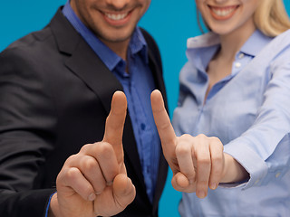 Image showing man and woman hands pointing at something