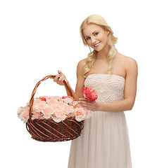 Image showing woman with basket full of flowers