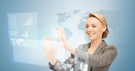 Image showing businesswoman working with virtual screens