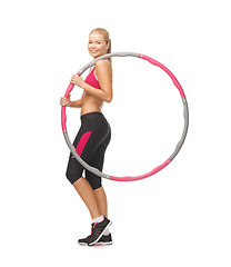 Image showing young sporty woman with hula hoop