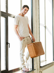 Image showing handsome man with retro suitcase