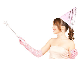 Image showing girl in party cap with magic stick