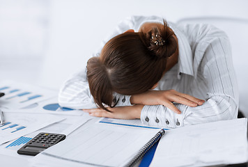 Image showing tired woman sleeping at work