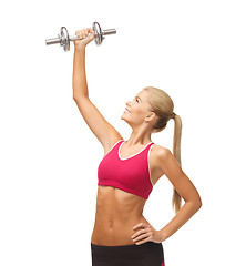 Image showing woman lifting steel dumbbell