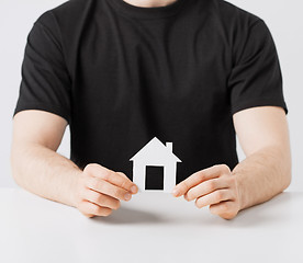 Image showing man hands holding paper house