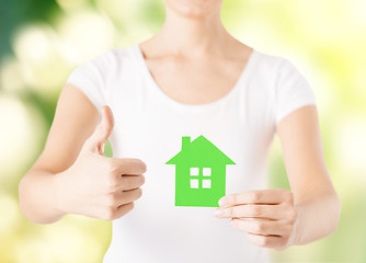 Image showing woman hands holding green house